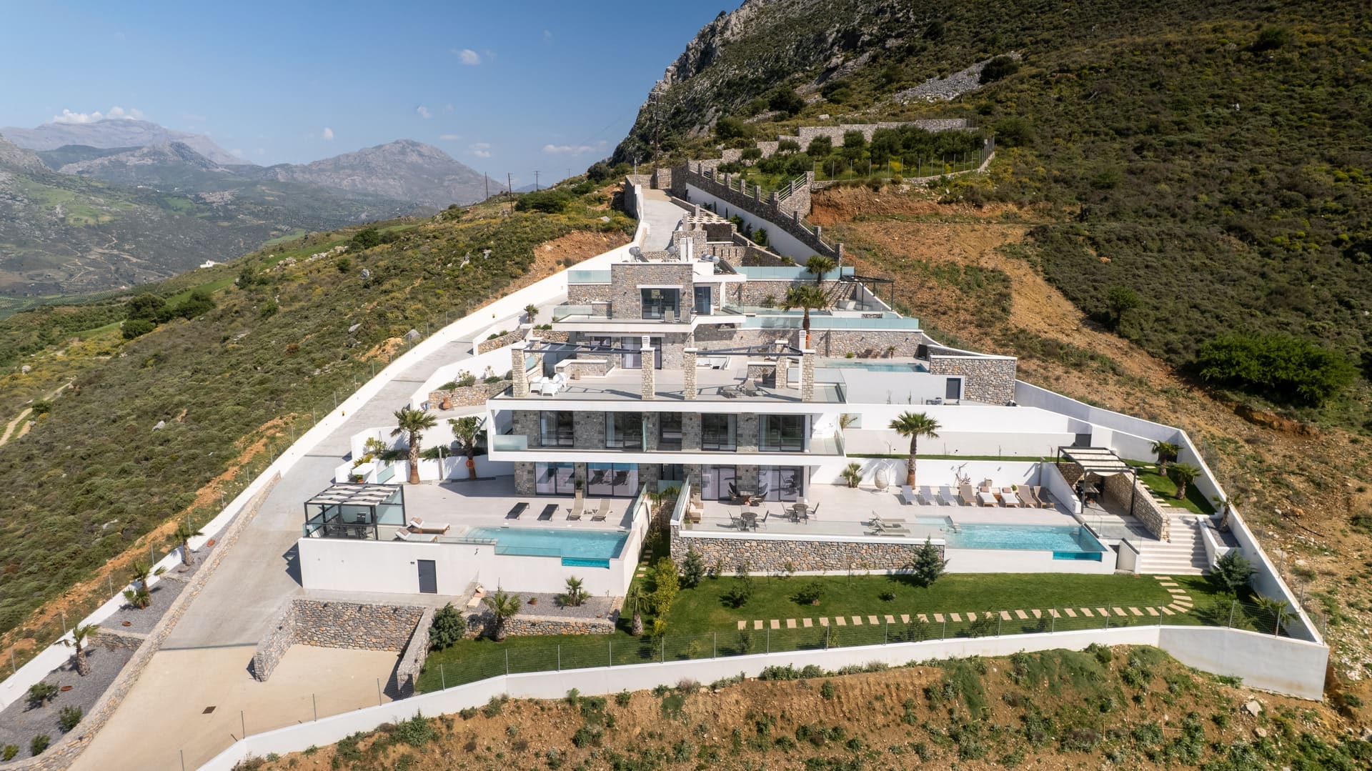Aerial drone overview of the estate with pool and mountain backdrop, Plakias Crete