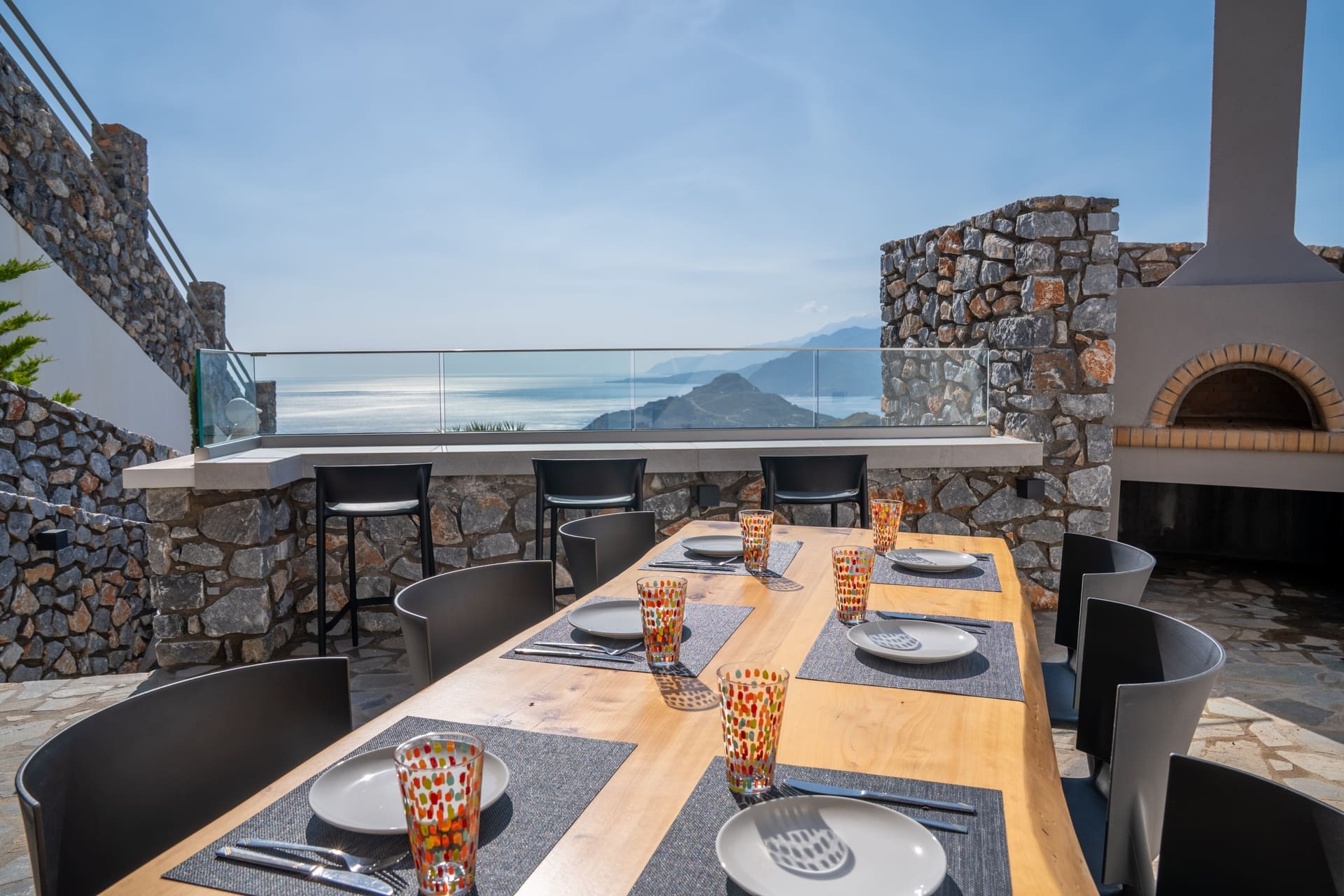 Outdoor dining table set near the pizza oven with mountain panorama, BBQ Endless View