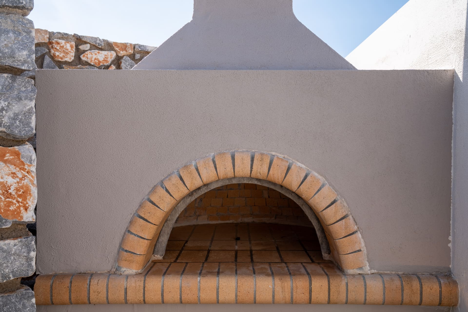 Wood-fired pizza oven brick arch closeup at the BBQ Endless View, Secret Oasis hill villas