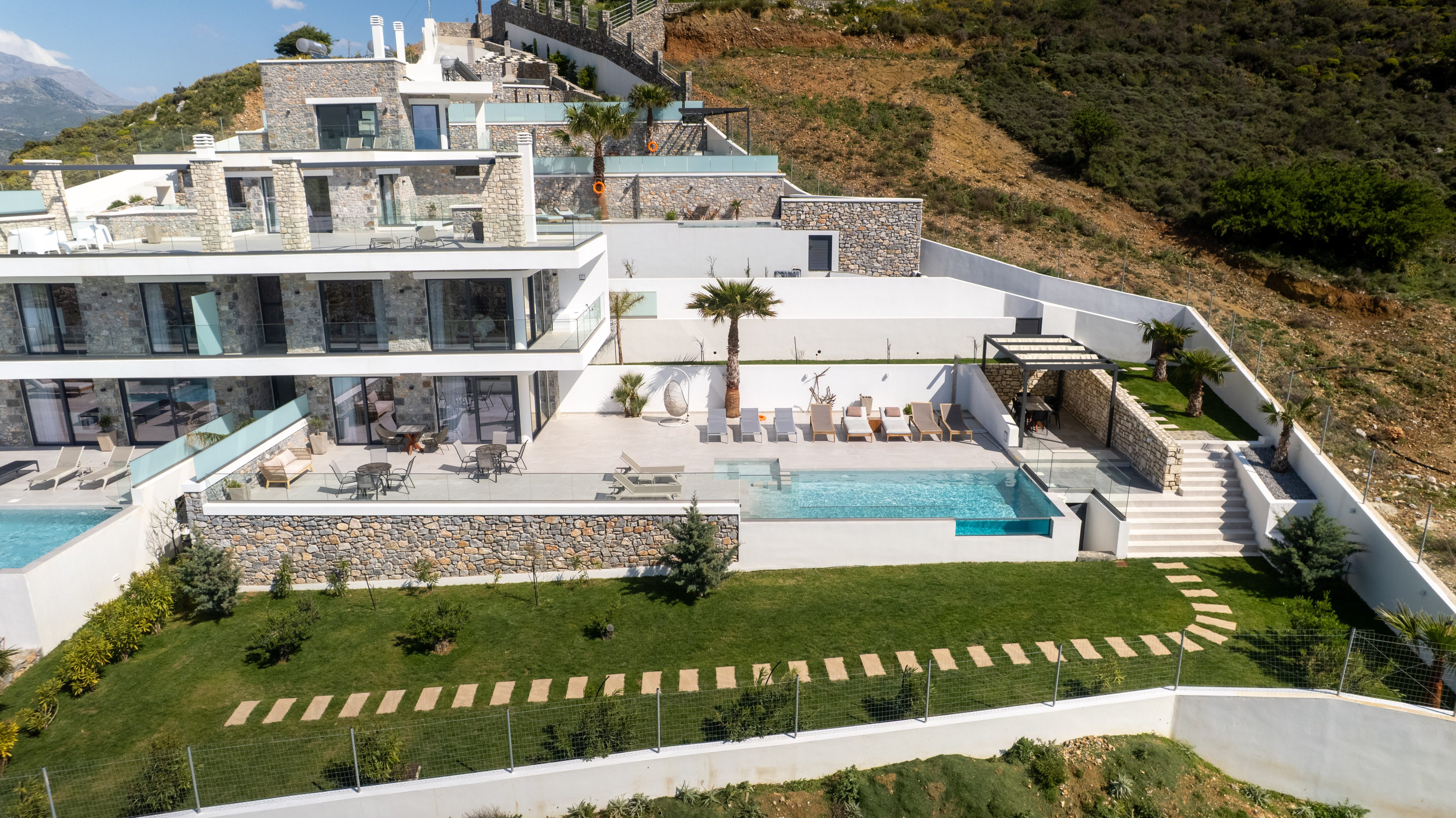 Villa 2 in Plakias, Crete — drone view of stone façade with private pool and terraces
